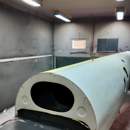 Wet paint booth applying a two-pack finish to a custom architectural feature